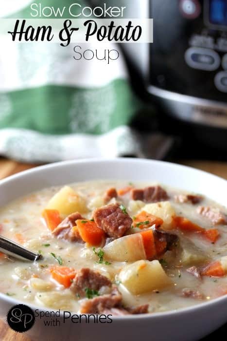 Once you taste this easy slow cooker ham and potato soup, you will never want to make anything else again. It is so rich and creamy, and perfect for cold winter days! #spendwithpennies #ham #potatoes #potatosoup #hamandpotatosoup #slowcooker #slowcookersoup #soup #comfortfood Slow Cooker Ham and Potato Soup in a bowl with a slow cooker in the background