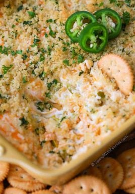 Jalapeno Popper Dip is my go to party appetizer. Rich cream cheese, spicy diced jalapenos and sharp cheddar are topped with crispy Panko bread crumbs and baked until warm and gooey. The result is the most incredible dip, reminiscent of the appetizer we all love so much!