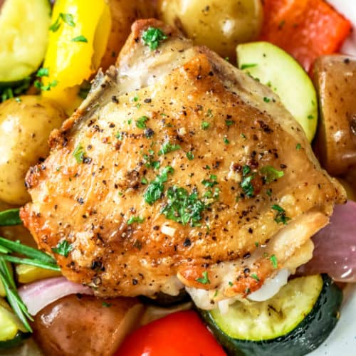Roasted Rosemary Chicken and vegetables on a white plate