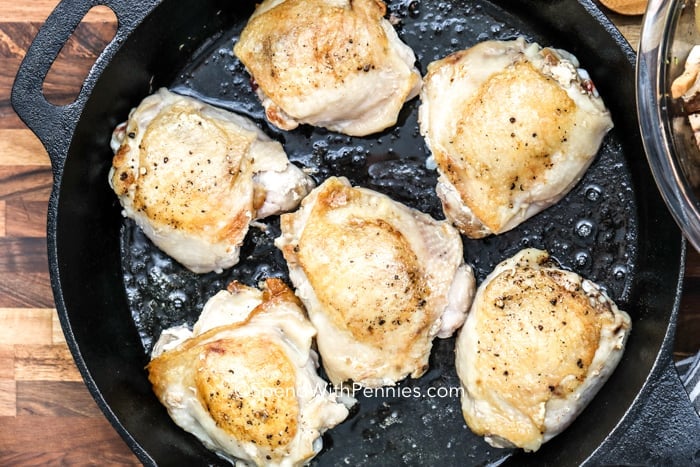 Overhead shot of chicken being cooked in a pan