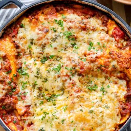 lasagna in pan topped with parsley