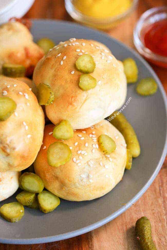 Bacon Cheeseburger Bombs on a gray plate with pickle slices