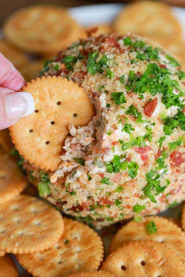 a cracker taking some Bacon Jalapeno Cheese Ball