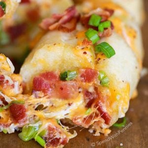 Cheesy Bacon Garlic Bread on a wooden cutting board
