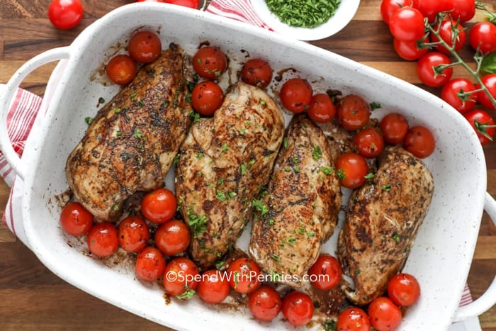 Chicken and tomatoes for Bruschetta Chicken in a casserole dish