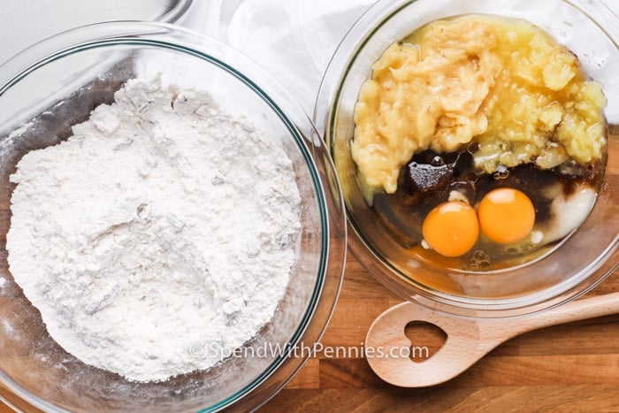 bowl of dry ingredients and a bowl of wet ingredients to make a Tropical Banana Snack Cake