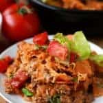 Layered Doritos Casserole is an easy family favorite recipe! Lean ground beef is seasoned with taco seasoning and salsa to create a delicious filling. Layers of Doritos create a delicious base for this casserole which is then topped with cheese and baked until brown and bubbly. We top it with our favorite taco inspired toppings!