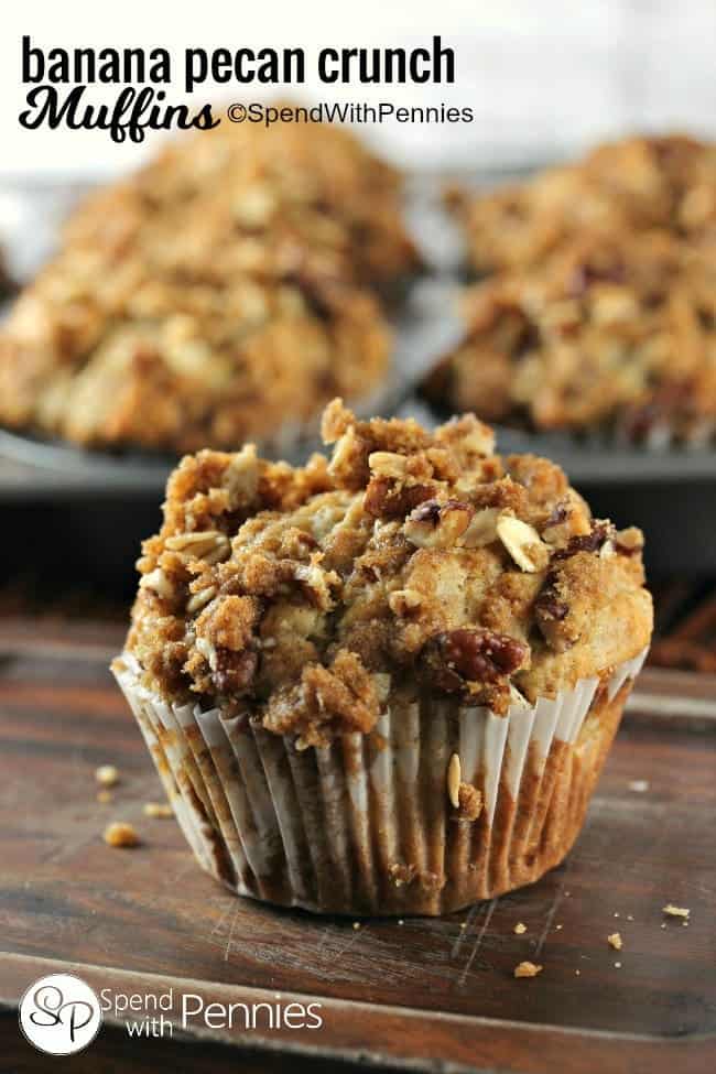 a Banana Nut Muffin with crunchy topping with a pan of muffins in the background