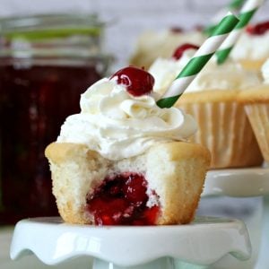 Cherry Pie Cupcakes topped with a cherry and a green striped straw