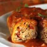 These easy cabbage rolls are the perfect comfort dish! Cabbage leaves stuffed with seasoned beef, pork & rice and baked in a delicious tomato sauce.