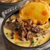 Cheesesteak Soup in a bowl with cheese bread