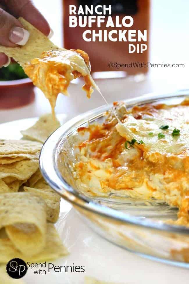 taking a serving of buffalo ranch chicken dip with a tortilla chip