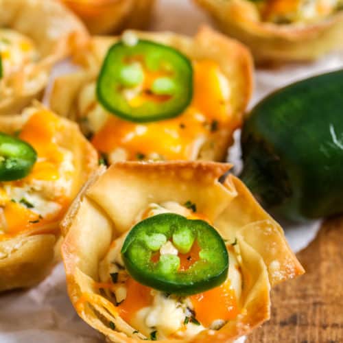 Jalapeno Popper Wonton Cups on parchment paper