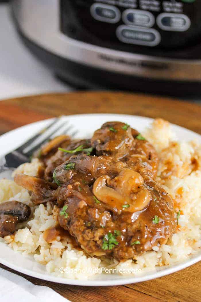 Crock Pot Salisbury Steak on a plate with rice