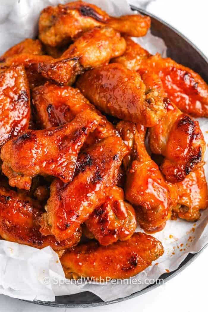 a plate of stacked hot sticky wings