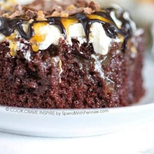 closeup of chocolate poke cake with a caramel and chocolate topping