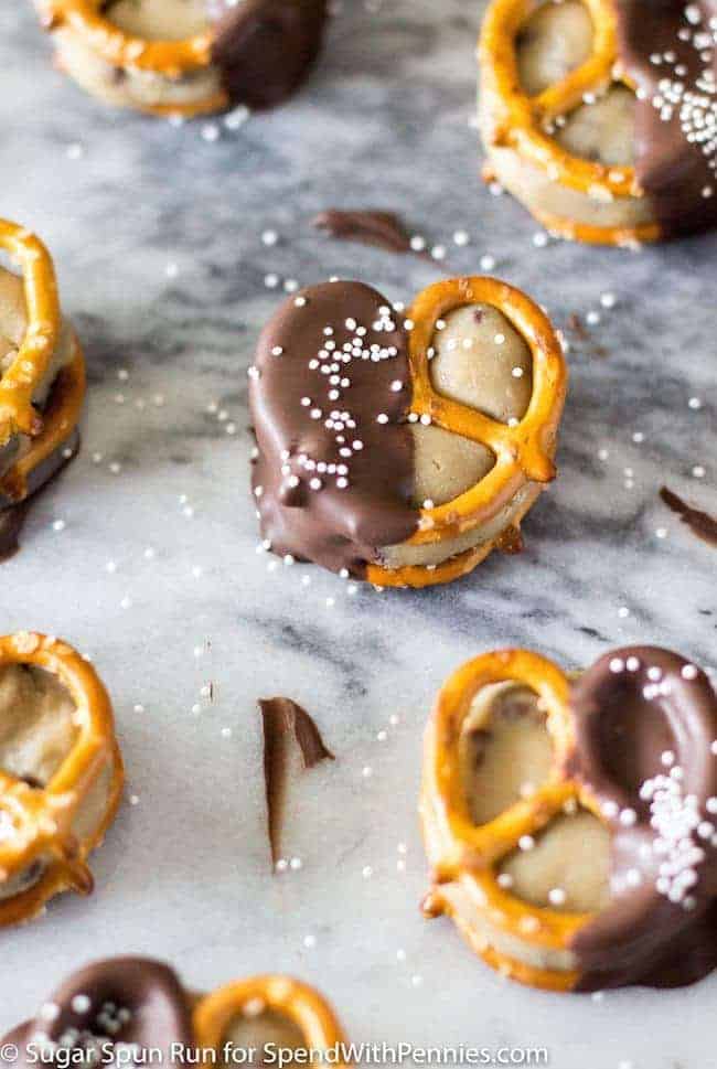 Easy Cookie Dough Pretzel Bites, egg-free cookie dough sandwiched between pretzels and dipped in dark chocolate