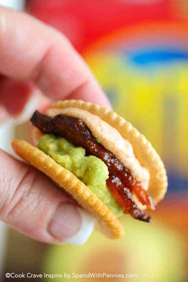 holding a Sriracha Bacon Ritzwich