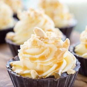 Closeup of Bite-Sized Snickers Cream Pies on a cutting board