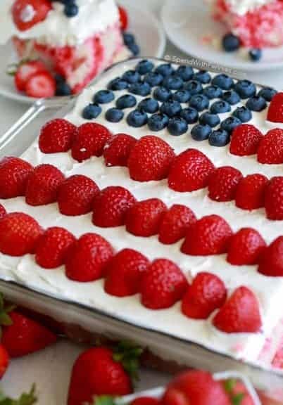 This Flag Cake topped with a no bake cheesecake is the perfect dessert for your 4th of July parties! The recipe comes together easily with your favorite white boxed cake mix (or your favorite homemade white cake) and the addition of a few simple ingredients. The cheesecake topping on this cake will have everyone asking for the recipe. It’s rich and light at the same time without being overly sweet!