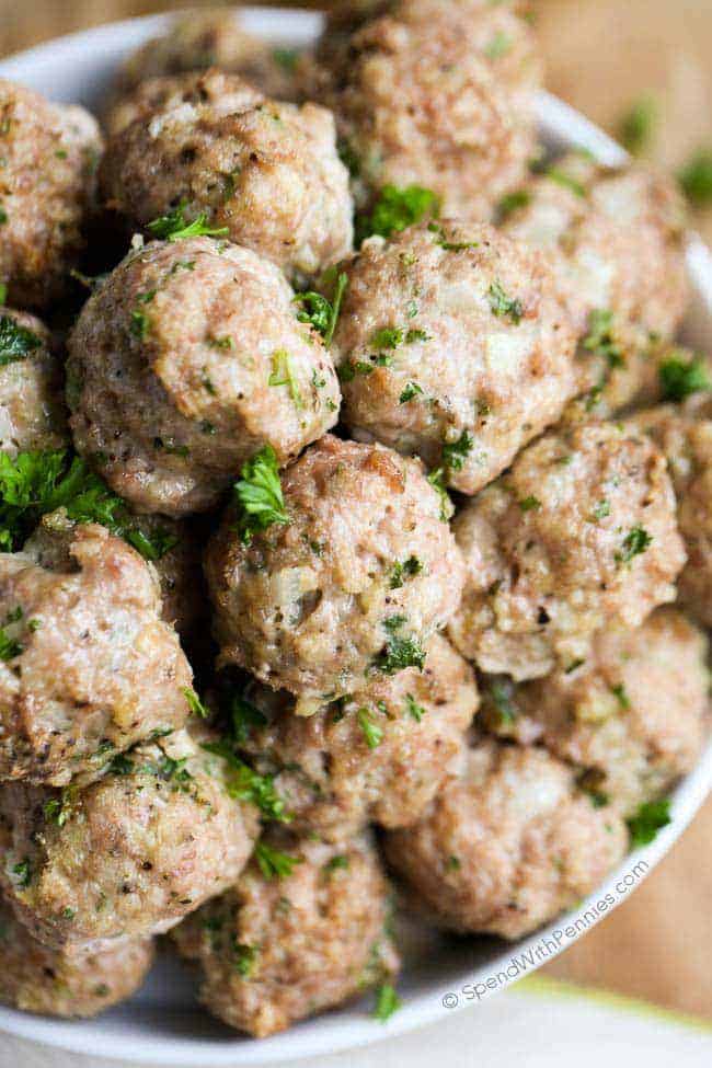 Make these all-purpose turkey meatballs, they are a healthier choice compared to regular beef or pork meatballs. Made from lean turkey meat, they provide a tasty and nutritious protein option. Enjoy them with pasta, in sandwiches, or as appetizers, and these turkey meatballs will surely satisfy your taste buds! #turkeymeatballs #allpurpose #meatballs #spendwithpennies Overhead shot of All Purpose Turkey Meatballs in a white bowl