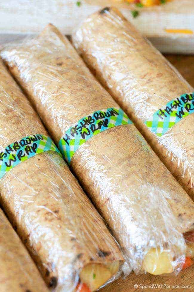Several Ham & Hash Brown Breakfast Wraps, wrapped in plastic and labled 