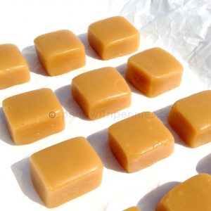 6 minute caramels laid out on parchment paper