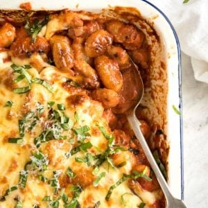 baked gnocchi with a spoon in a pan