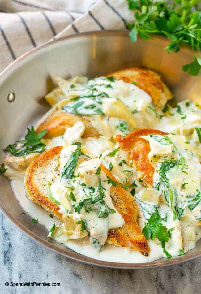 creamy spinach and artichoke chicken In a skillet