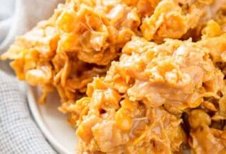 No bake peanut butter cornflake cookies on a white plate