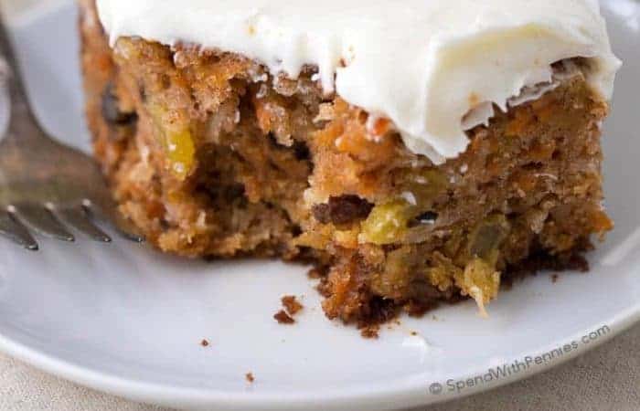 Billy homemade carrot cake with frosting on white plate