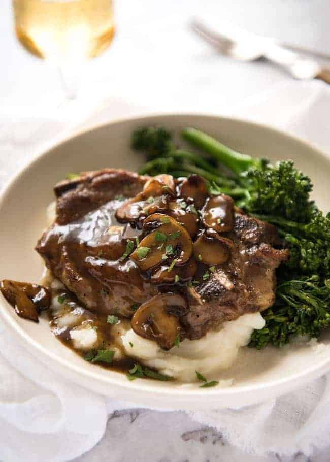mushroom pork chops over mashed potatoes with cooked broccoli