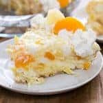 Piece of Ambrosia Pie on a white plate