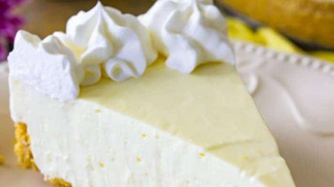 Slice of Lemon Cheesecake on a white plate