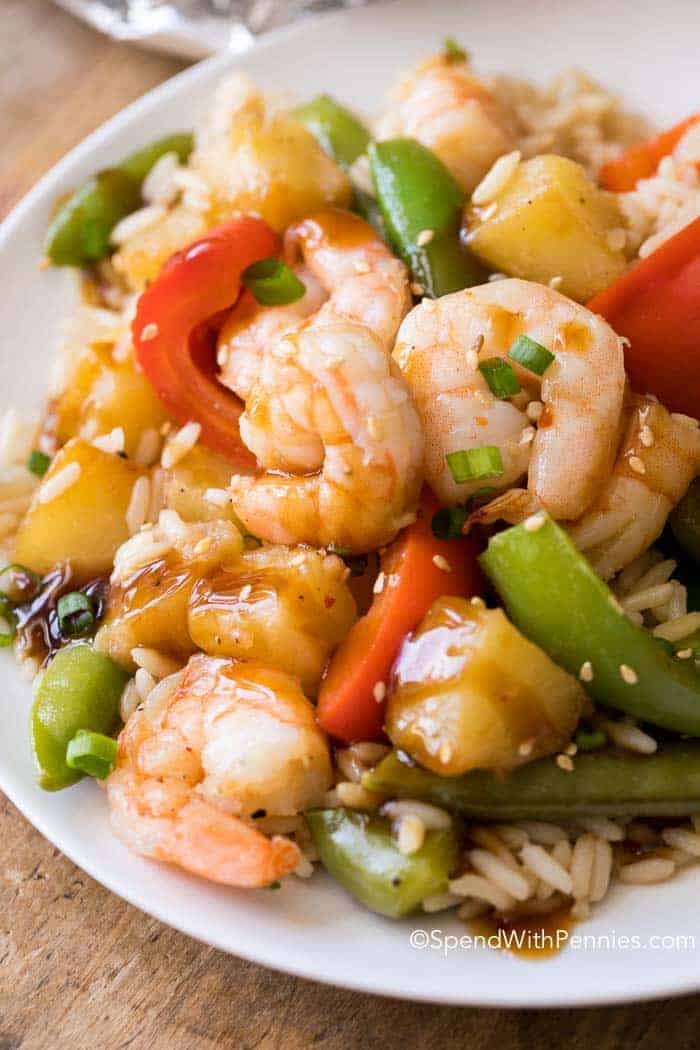 Teriyaki Shrimp with rice and peppers on plate