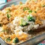 Broccoli Rice Casserole being served with wooden spoon