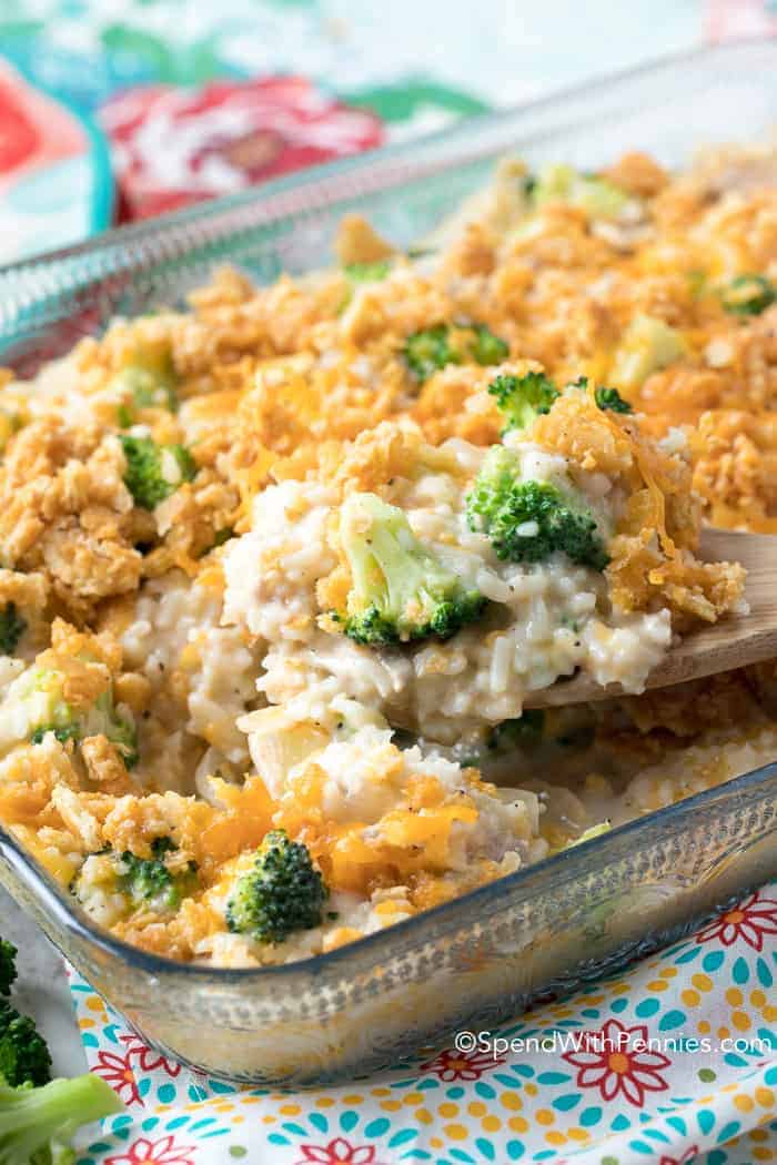 Broccoli Rice Casserole being served with wooden spoon