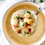 New England Clam Chowder in a ladle