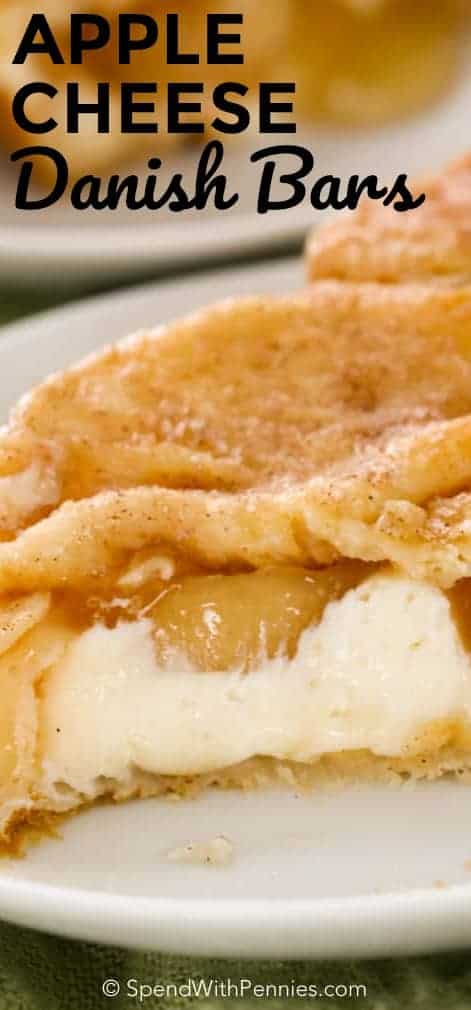 Apple Cheesecake Bars on a white plate with writing