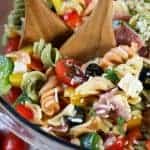 Italian Pasta Salad with spoons in a clear bowl