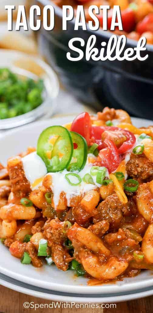 Beef Taco Pasta is the perfect weeknight meal with beef, cheese, macaroni and loads of delicious taco flavor! Top this easy 30 minute meal with your favorite taco fixings like cheese, jalapeno and sour cream! #spendwithpennies #taconight #tacopasta #tacopastaskillet #onepotmeal #onepanmeal #30minutemeal #easydinner #tacoskillet #macaroniandcheese #tacomacandcheese #chilimac