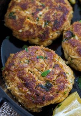 crab cakes in a cast iron pan