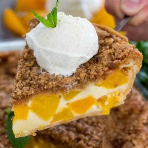 Slice of Peach Pie with ice cream and mint