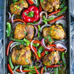 Chicken Shawarma with peppers and onion on sheet pan