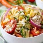 Summer Pasta Salad in a white bowl with a fork