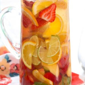 White Sangria with strawberries, limes and oranges