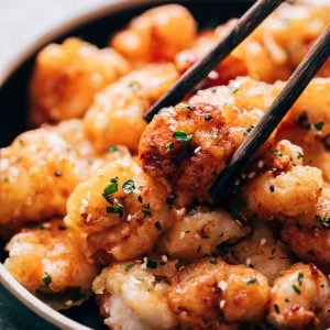 Picking up bang bang shrimp with chopsticks