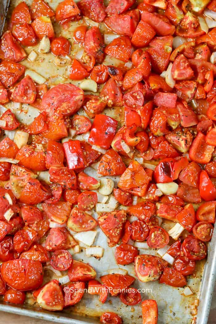 Tomatoes and garlic on a baking pan