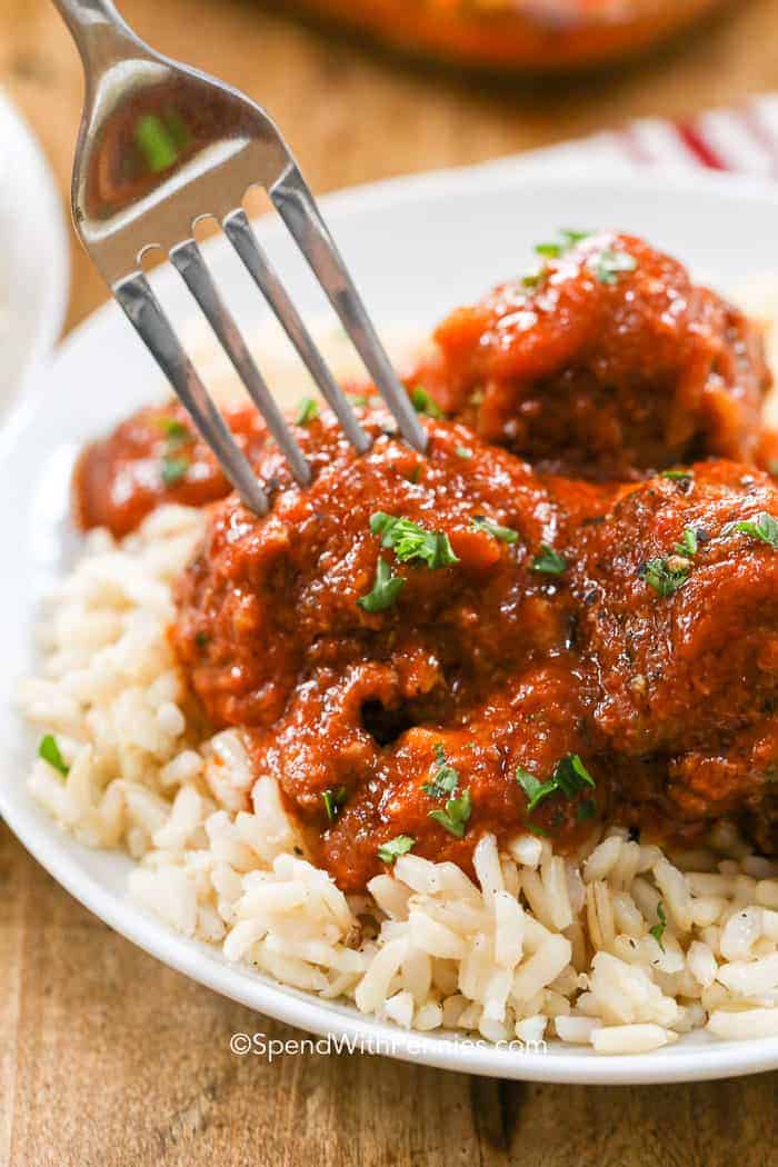Lifting a Porcupine Meatball off plate with a fork