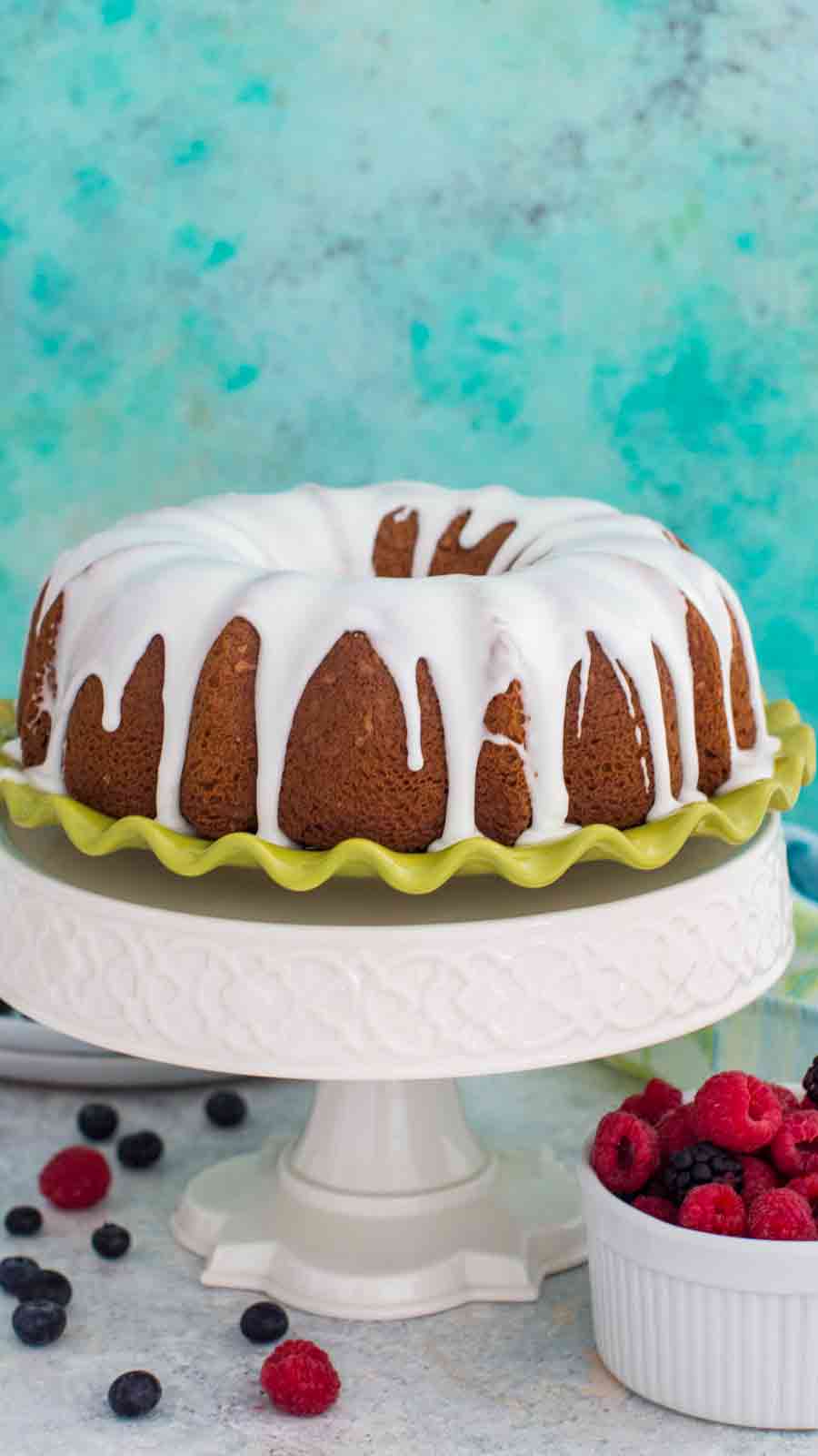 Whole Vanilla Bundt Cake on tall serving platter.